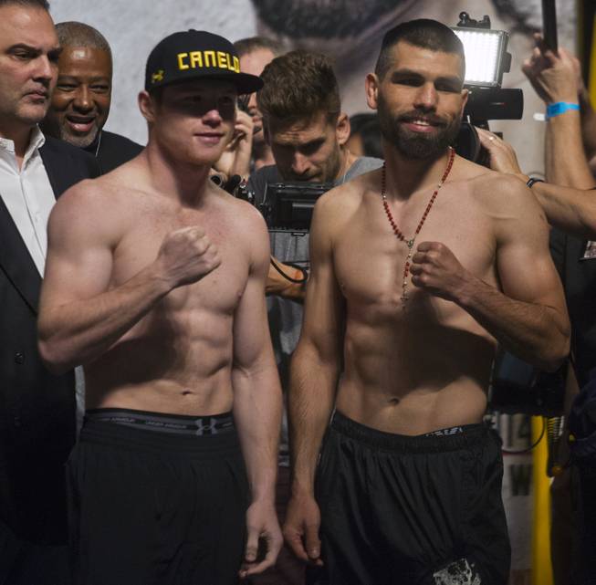 Super welterweights Canelo Alvarez and opponent Alfredo "El Perro" Angulo , both of Mexico, face their fans following their weigh-ins at the MGM Grand Arena on Friday, March 07, 2014.